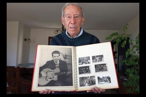 Veissid shows his souvenir photographs in Allauch, southern France